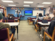 Iron Range Resources & Rehabilitation Commissioner Ida Rukavina and Research Analyst KeKe Stephenson speak to Mesabi East students in Aurora