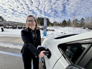 Commissioner Ida Rukavina Charging Vehicle at Iron Range Resources & Rehabilitation