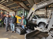 Babbitt ATV & Snowmobile Club volunteers with new mini excavator