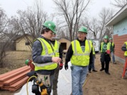 Rock Ridge High School building construction instructor and students 