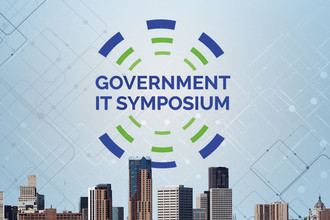 Government IT Symposium logo in the sky over St. Paul buildings.