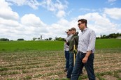 Farmers standing in a field
