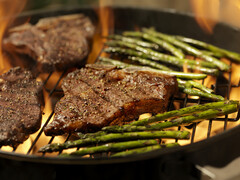 Grilling steaks and asparagus