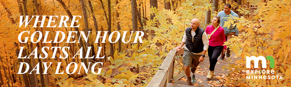 People hiking through a forest of golden leaves with text, "Where Golden Hour Lasts All Day Long"