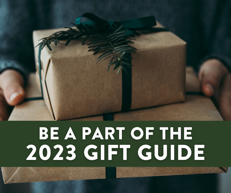 2023 Holiday Gift Guide with photo of hands holding brown paper wrapped gift with evergreen decoration