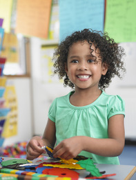 Smiling African American girl in preschool