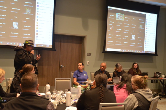 Jane Harstad, Commissioner Willie Jett and listen to a man speak during the field hearing. 