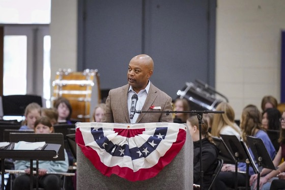 Commissioner Willie Jett speaks at a podium