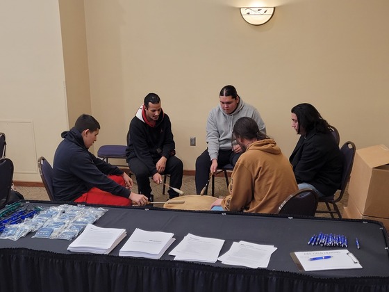 Drummers beat on the drum