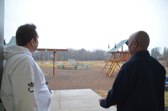 Commissioner Jett and Erik Skanson look out at the playground