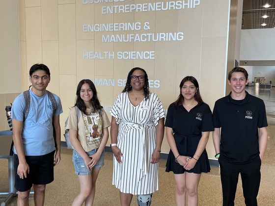 Angela Mansfield stands with a group of students