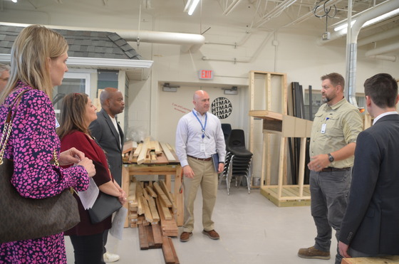 Scott Wickland speaks to visitors to his construction classroom
