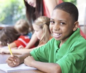 Boy reading at desk