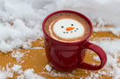Hot chocolate cup with snowy background
