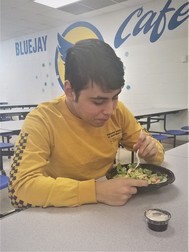 Waseca student eating salad