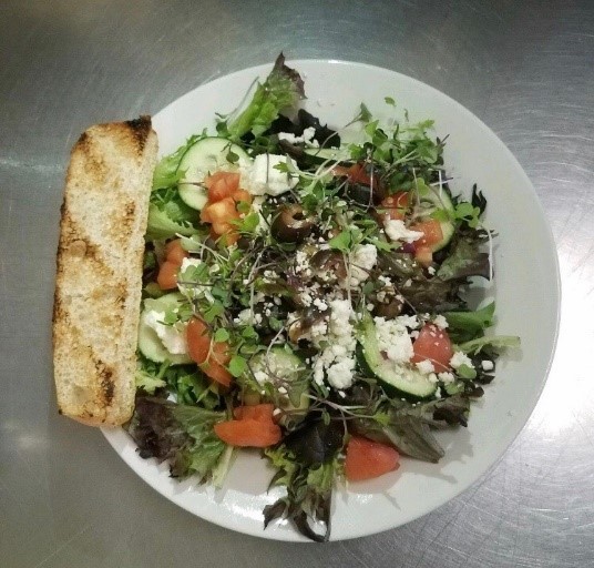 The Mediterranean Salad features lettuce and microgreens from a local vegetable farm.