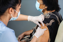 woman getting COVID-19 vaccine 