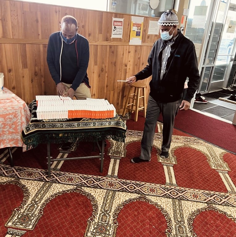 two men organizing covid 19 rapid test kits