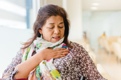 woman holding chest