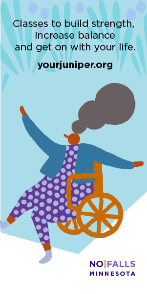 Picture of a woman in a wheelchair with her arms raised