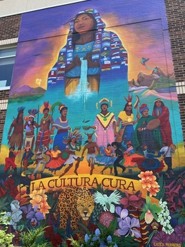 A mural titled La Cultura Cura