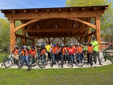 Group of people sitting on bikes 