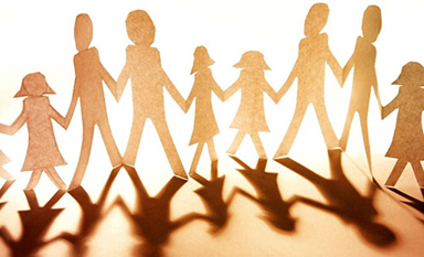 Paper cutout of people holding hands