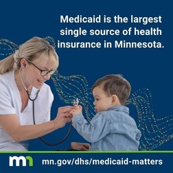 Health care provider showing a stethoscope to a young child