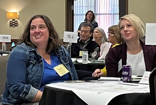 People smiling at a planning retreat