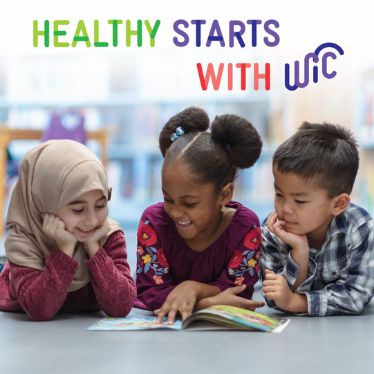 three kids reading a book