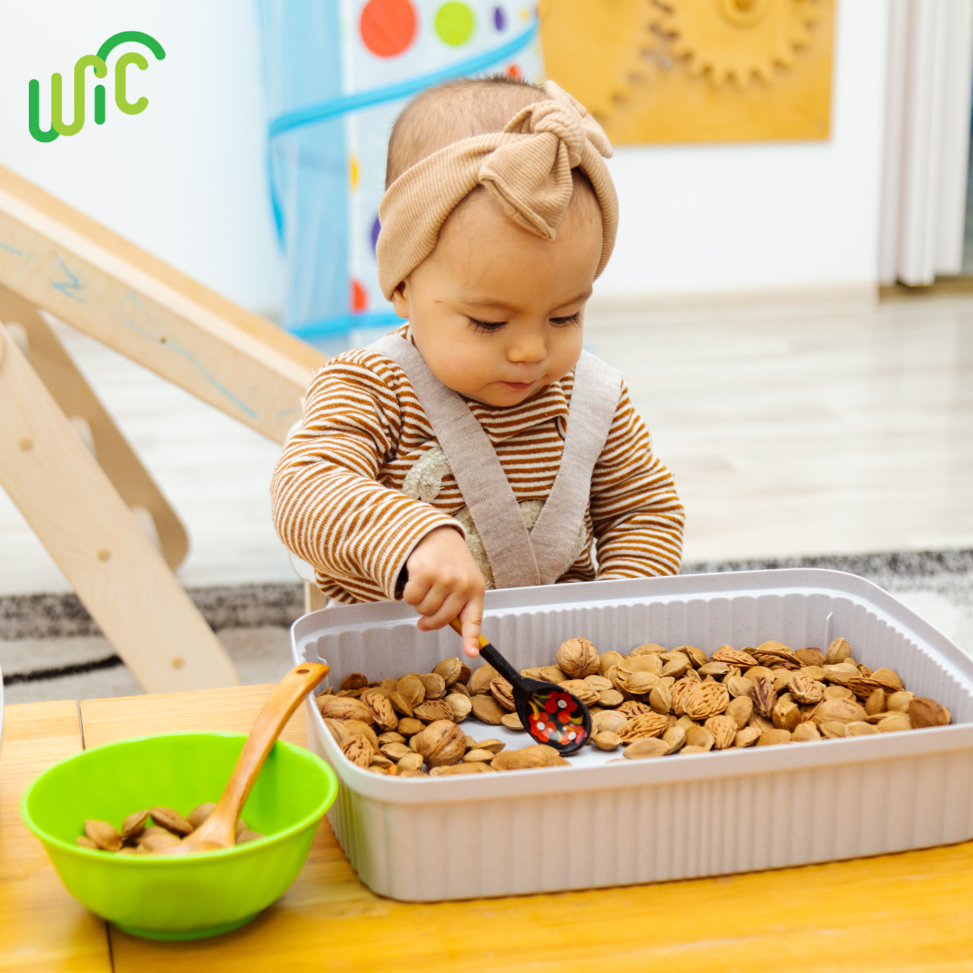 toddler playing in food dish