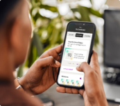 User holding phone using the new My Life, My Quit app
