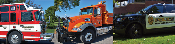 Fire truck, orange public works truck, and police squad.