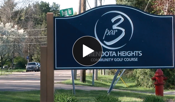 New entrance sign for Par 3 in scalloped shape with logo in white, text "par 3" in center of circular swooshes, on navy blue background.