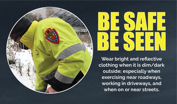 Man in safety yellow reflective jacket working outside, text "Be Safe Be Seen" in bright yellow on dark background; see below for more.