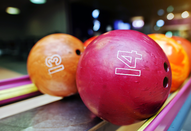 Colorful bowling balls on rack