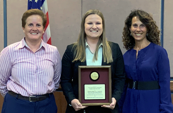 Photo of MRPA Representative Tracy Peterson, Rec Manager Meredith Lawrence holding the MRPA Award, and Mayor Levine at June 7 council meeting.  