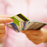 Woman holding various credit cards