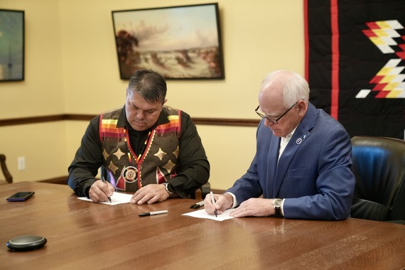 Chief Executive Virgil Wind of the Mille Lacs Band of Ojibwe and Governor Tim Walz sign a Tribal-state cannabis compact on Sept. 10, 2025
