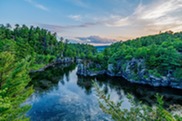 River with rocky banks with trees