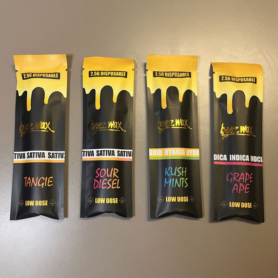 Front of the Beezwax vape packaging in a variety of flavors including Tangie, Sour Diesel, Kush Mints, and Grape Ape.