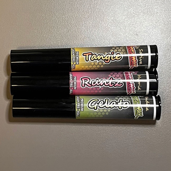 Beezwax preroll packaging in a variety of flavors including Tangie, Runtz, and Gelato.