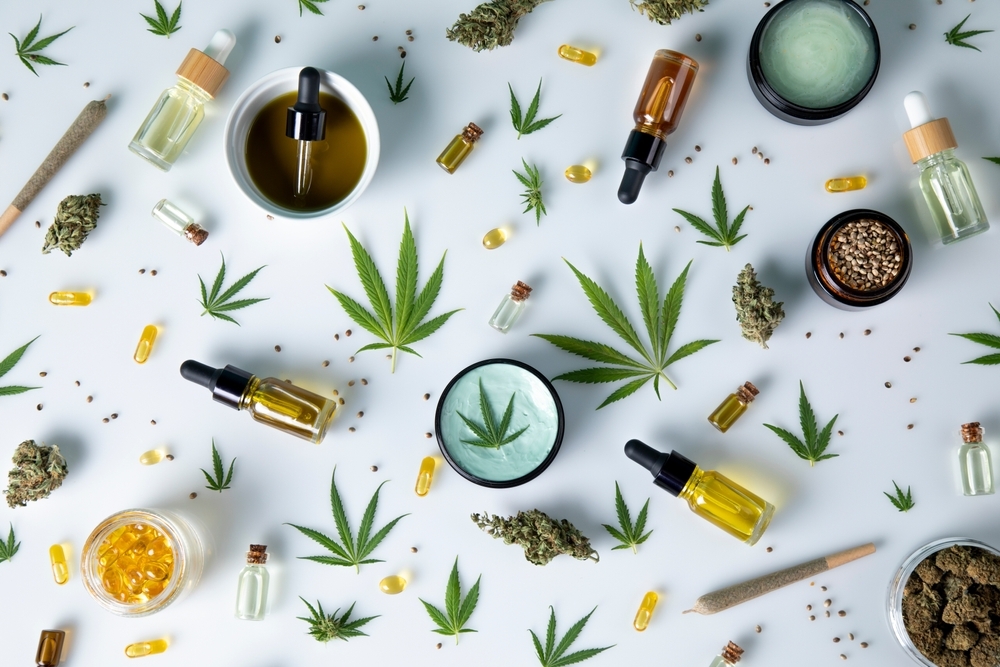 Cannabis hemp oil bottle with hemp seeds, hemp leaf, cannabis oil and marijuana