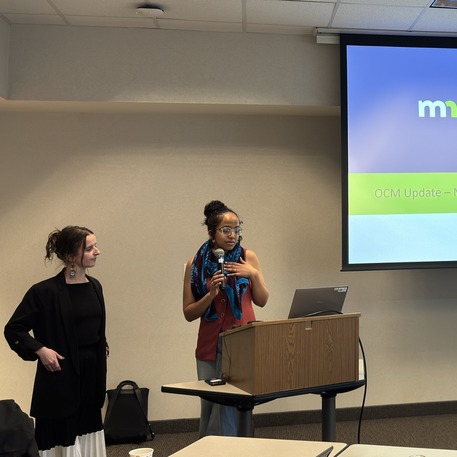 Merone Melekin and Sophie Leininger speaking at event