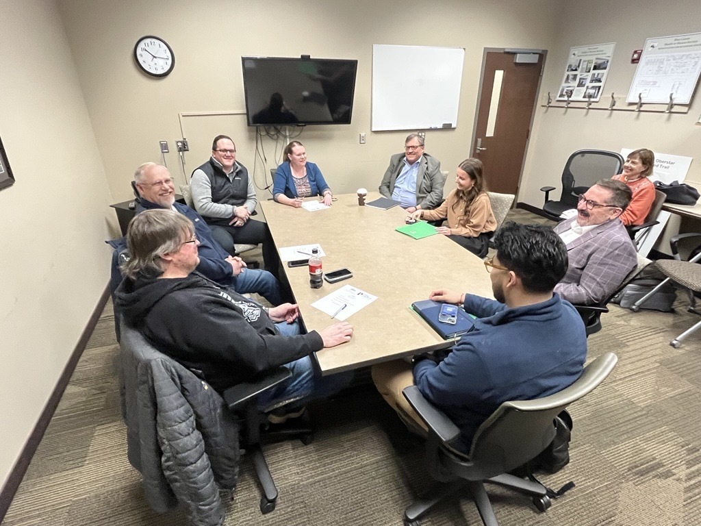 OCM staff and pine county officials sitting around conference table