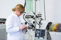 woman testing cannabis concentrate in lab