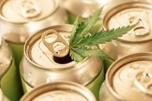cans with a cannabis leaf sticking out of the top