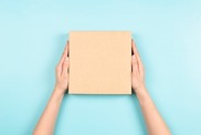 Female hands holding box 