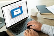 Person checking email inbox with new email notification