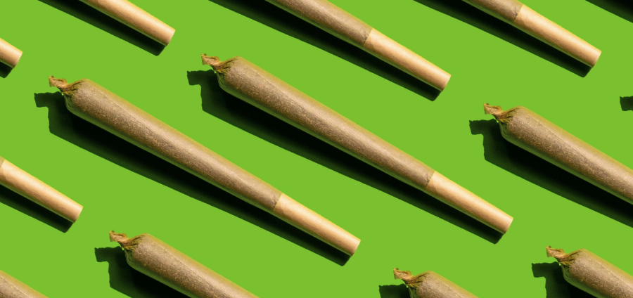 cannabis joints on green background